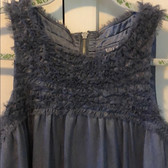 Slightly shimmering and a fluffy neckline - Picture 3 of 7